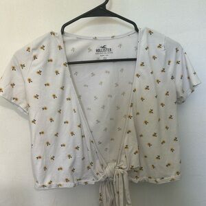 White baby tee with a tie in front. Hollister size small.